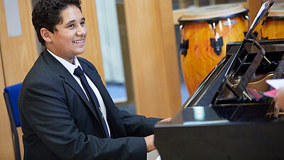 Pupil playing piano