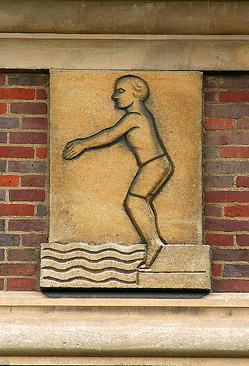 Stone carved image of swimmer