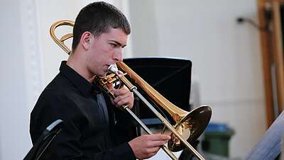 Boy playing a trombone